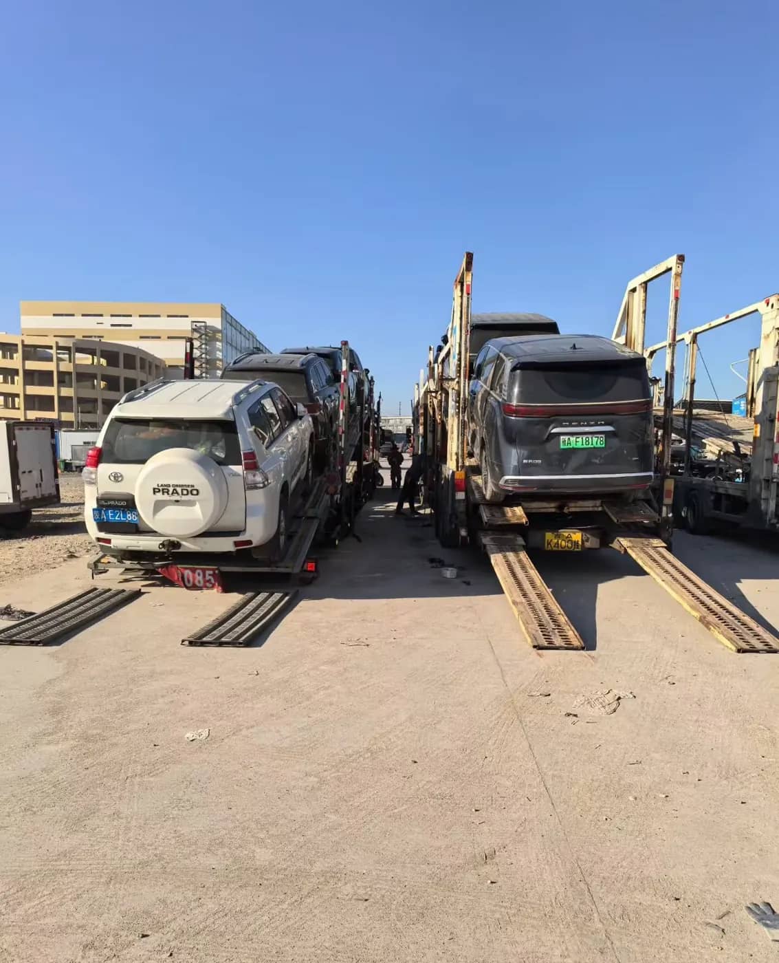 Vehicles loaded on a car-carrier truck